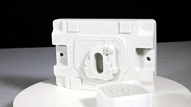 Pellet tray beside white layered printed part (SKU ask)
