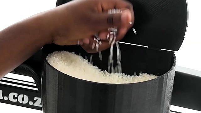 Pouring plastic pellets into hopper (SKU ask)