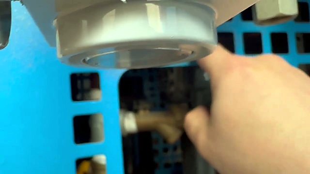 Blue mesh guard into dryer plumbing bay (SKU ask)