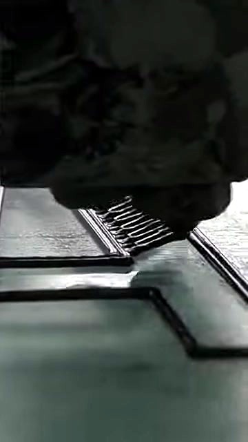 Nozzle laying black infill into letter outline (SKU ask)