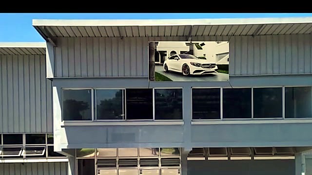 Finished Mercedes PVC banner installed on building facade (SKU ask)