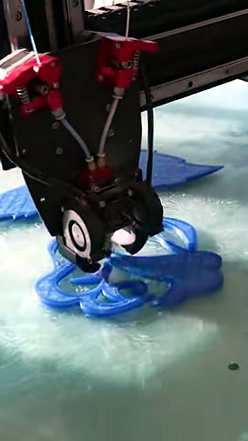 Dual-extruder head printing translucent blue scrollwork (SKU ask)