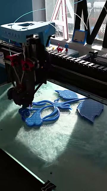 Blue scroll print on bed; channel letter A in background (SKU ask)