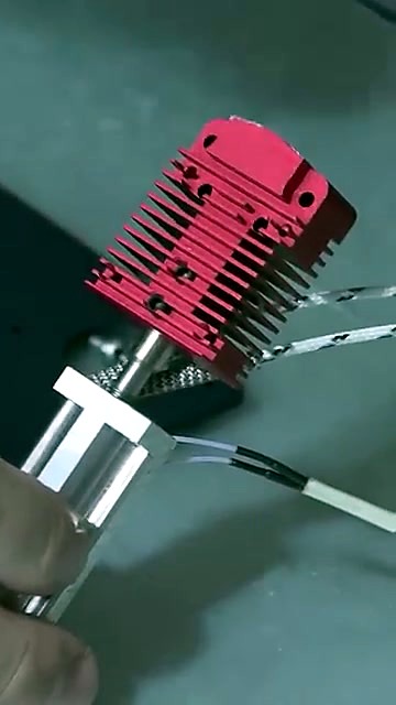 Red heat-sink hex-key mount on black plate (SKU ask)