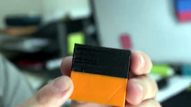 Finished orange/black dual-colour cube close (SKU ask)