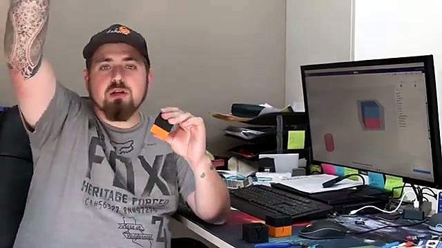 Presenter holding dual-colour PrintUP result (SKU ask)