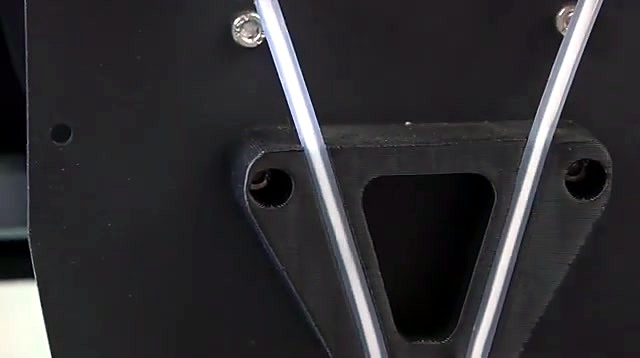Dual translucent PTFE tubes in black guide bracket (SKU ask)