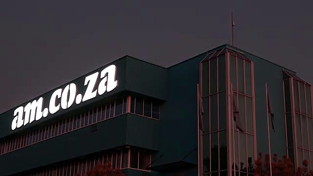 Night illuminated am.co.za channel letters on Sunnyrock HQ (SKU ask)