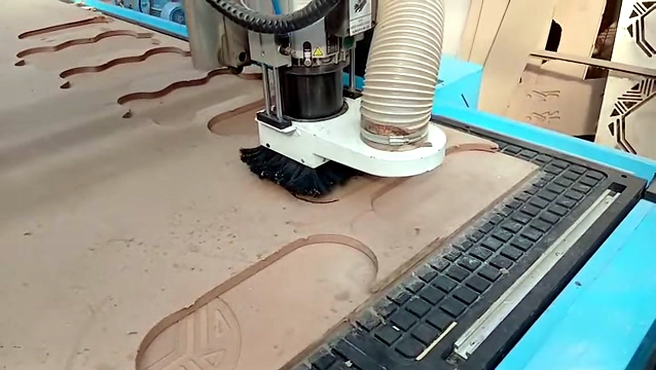 R-2030K/90L ATC CNC cutting Supawood MDF 16mm (text/shape) on MDF spoilboard