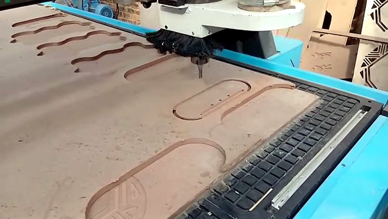 R-2030K/90L ATC CNC cutting Supawood MDF 16mm (text/shape) on MDF spoilboard