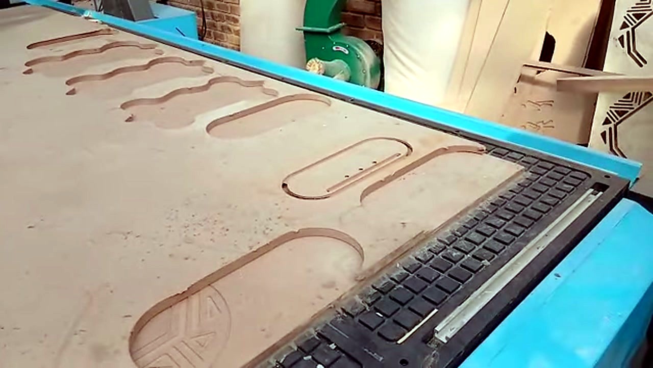 R-2030K/90L ATC CNC cutting Supawood MDF 16mm (text/shape) on MDF spoilboard