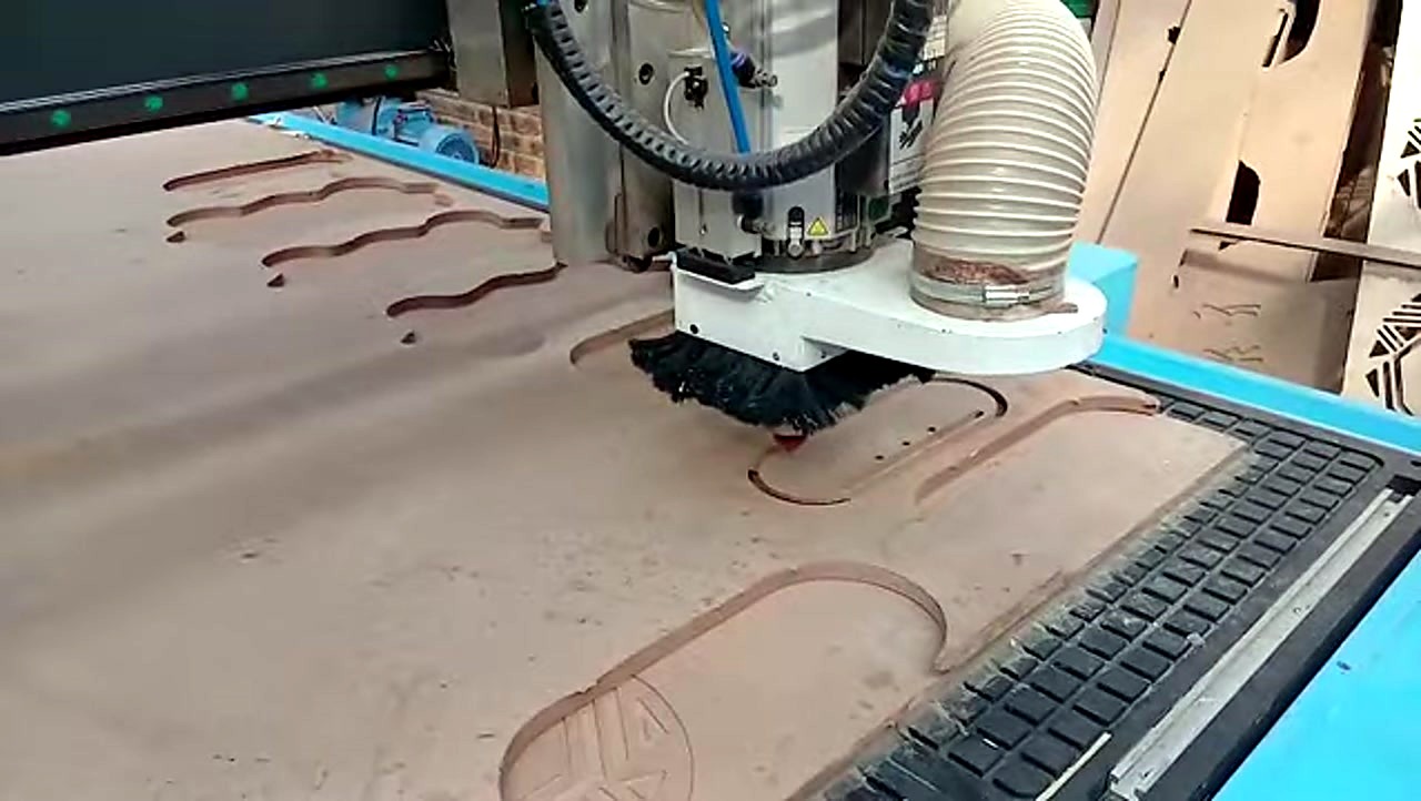 R-2030K/90L ATC CNC cutting Supawood MDF 16mm (text/shape) on MDF spoilboard