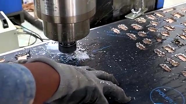 Spindle bit cutting dark sheet white swarf (SKU ask)
