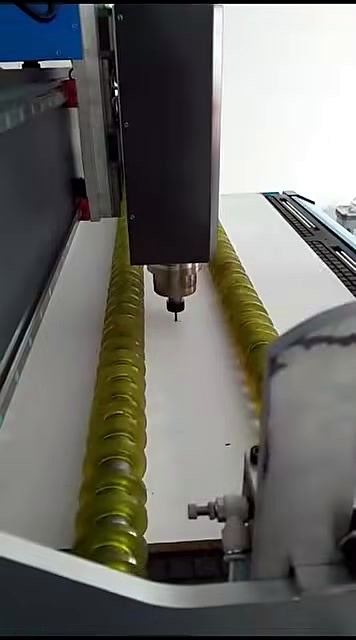 CNC fixed spindle + bit between hold-down rollers on white sheet (SKU ask)
