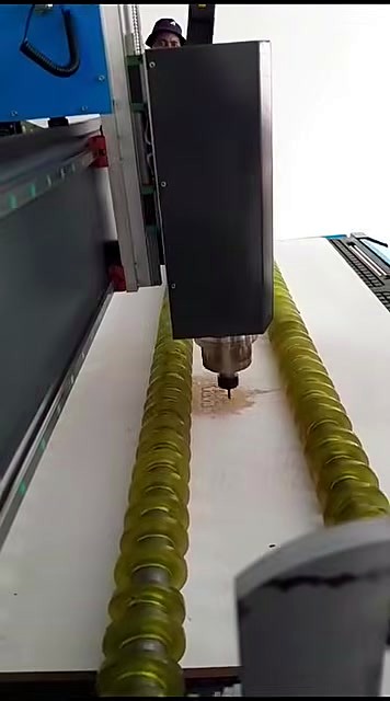 Spindle cutting white sheet; rollers visible (SKU ask)