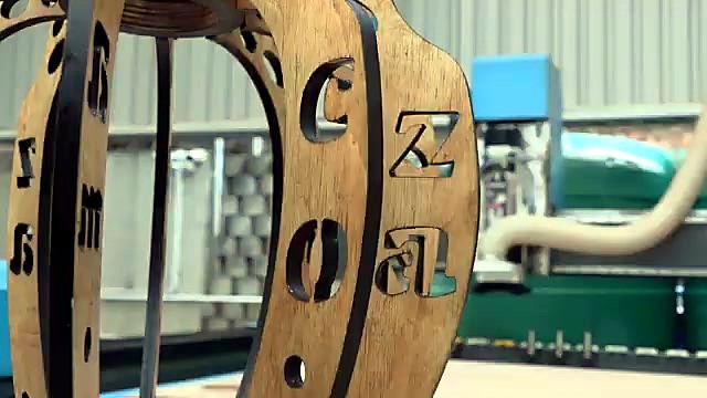 Assembled wooden fixture with am.co.za cutouts