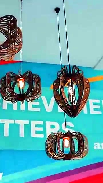 Lit custom pendants hanging in AM reception