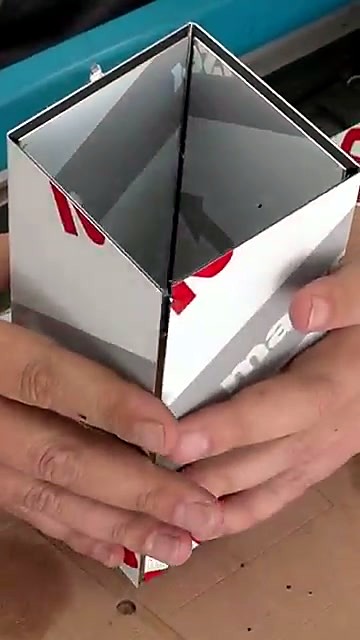 Hands folding grooved ACM into box/pillar (SKU ask)
