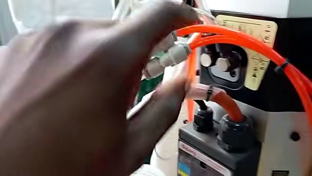 Orange pneumatic line into silver push-fit fitting (SKU ask)