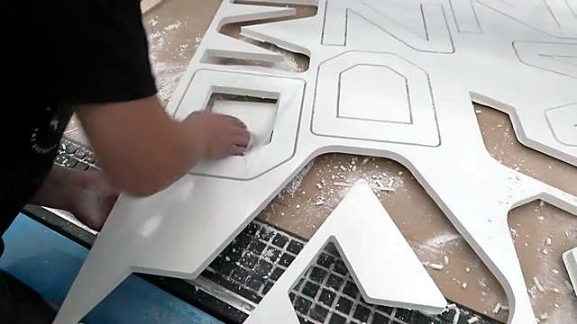 AM letters weeded from thick white PVC foam sheet (SKU ask)