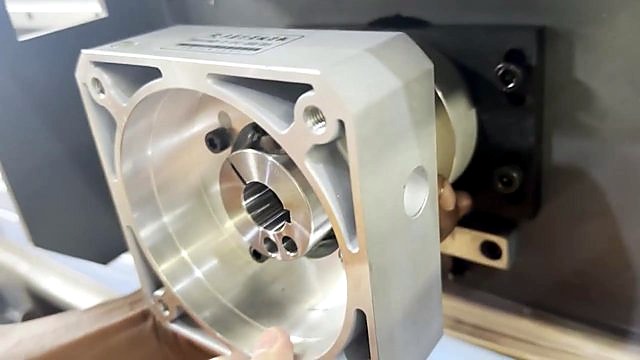 Grey gearbox housing aligned to circular end-plate opening (SKU ask)
