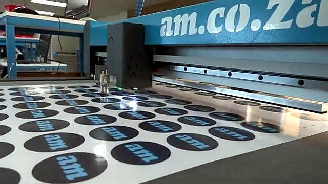 am.co.za circular logo cutouts on black-faced sheet (SKU ask)