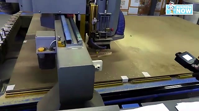 Spindle cutting light-green board on vacuum bed (SKU ask)