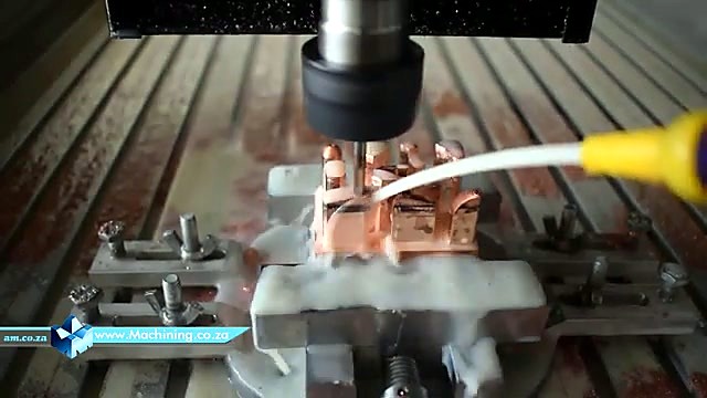 T-slot clamps holding brass workpiece (SKU ask)