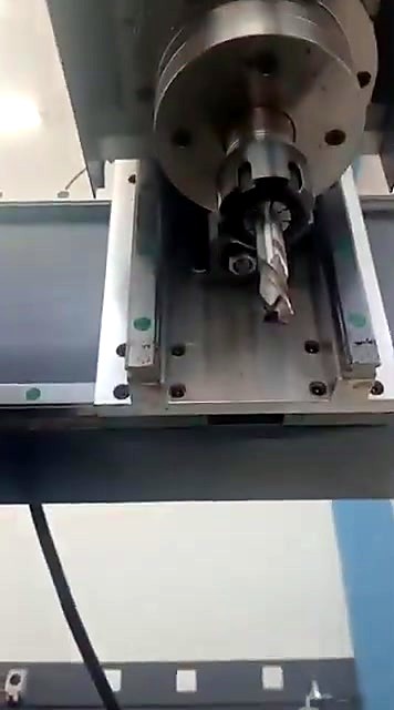 12mm end mill mounted in the ER25 collet on the EasyRoute CNC spindle above the gantry rails