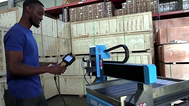 Tech holding DSP beside Express DIY spindle (SKU ask)