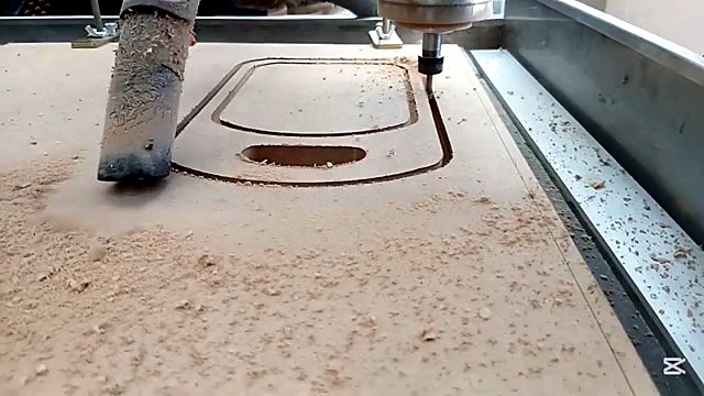 Operator handheld vacuum dust during cut (SKU ask)