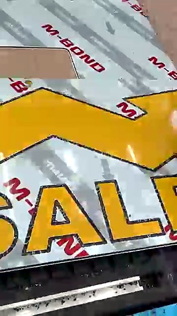 Peel film revealing yellow SALES + arrow cut (SKU ask)