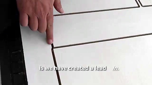 Hand points lead-in entry on melamine groove (SKU ask)
