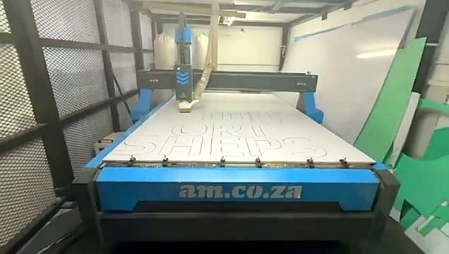 Wide branded EasyRoute CNC in workshop with green scrap sheets (SKU ask)