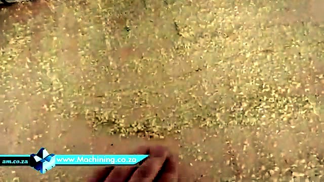 Hand brushing sawdust near roller path (SKU ask)