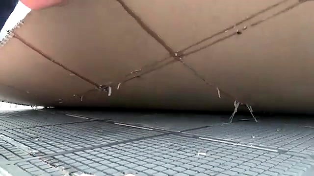 Vacuum grid bed revealed under lifted spoilboard (SKU ask)