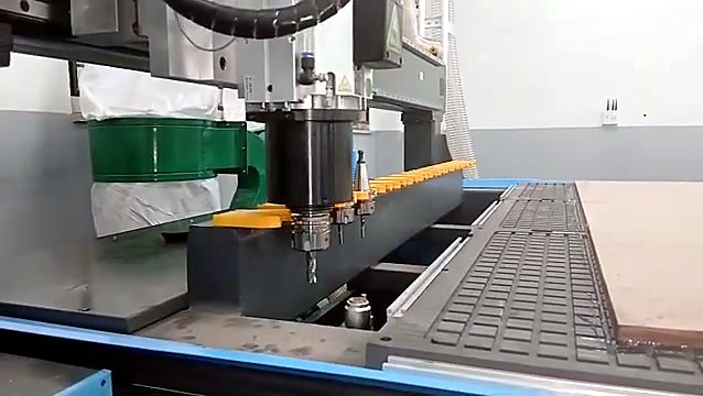 Linear tool rack beside the grid vacuum table