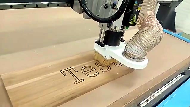 'Test' lettering carved into the wood board by the R-1325K/90L