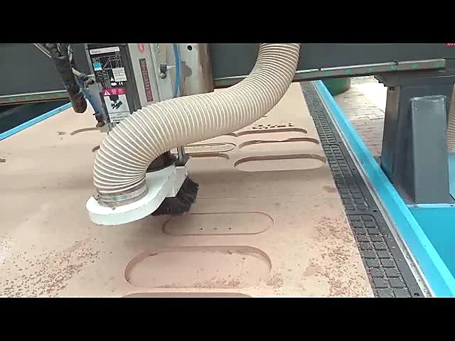 R-1325K/90L ATC spindle with dust hood routing obround pockets in MDF