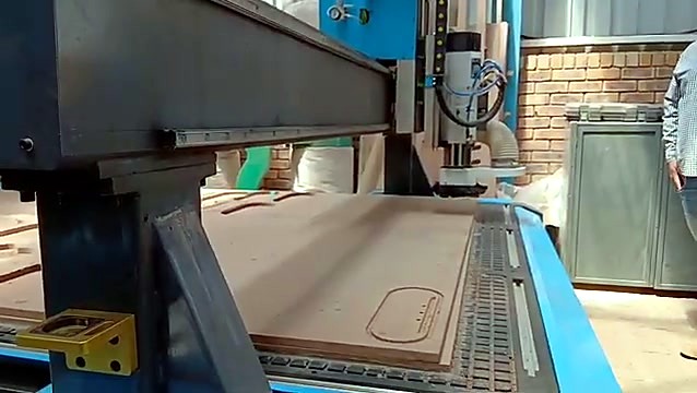 Gantry over nested wood parts on vacuum table