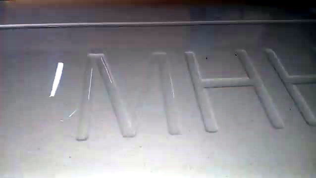 Letters engraved into the engineered quartz stone surface