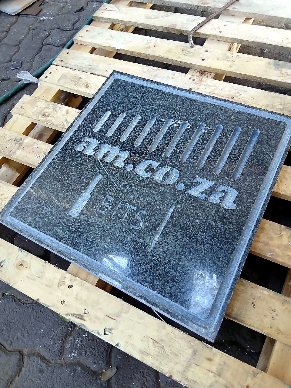 R-1325W/55 stone router sample: polished granite am.co.za BITS plaque, second angle (staff still)