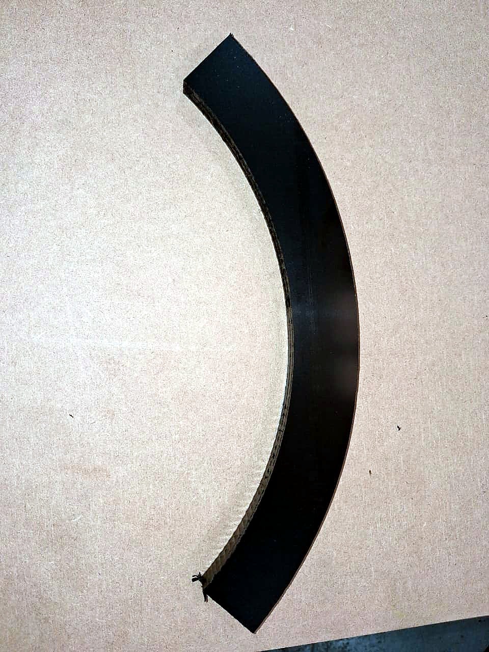 R-2030K/55L EasyRoute: CNC-cut black curved arc part on board (cut sample, staff still)