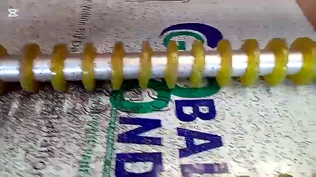 Ribbed rollers + bit + black ACP swarf close-up (SKU ask)