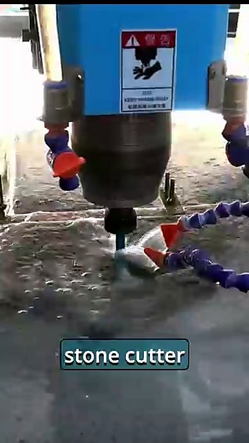 Spindle with stone router bit cutting wet stone