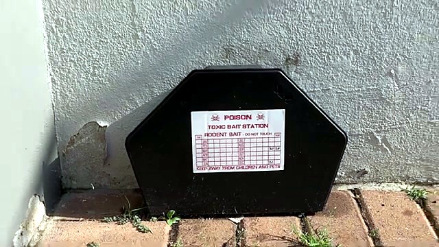 Bait-station sticker applied on black box outdoors (SKU ask)
