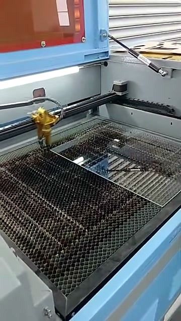Loading clear acrylic onto CO2 laser bed (SKU ask)