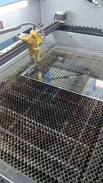 CO2 cabinet: gold laser head over clear acrylic on honeycomb bed (SKU ask)