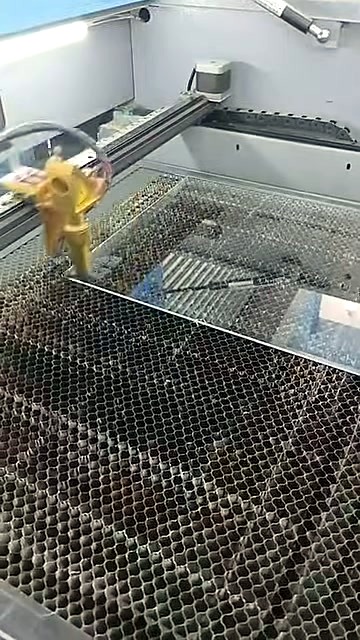 Gold laser head over Perspex on bed (SKU ask)