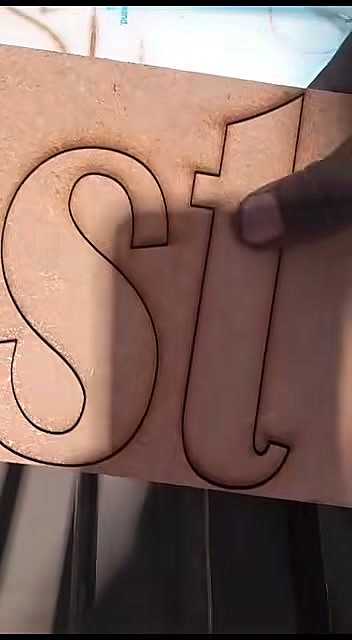 Finger pressing cut letter free from sheet (SKU ask)